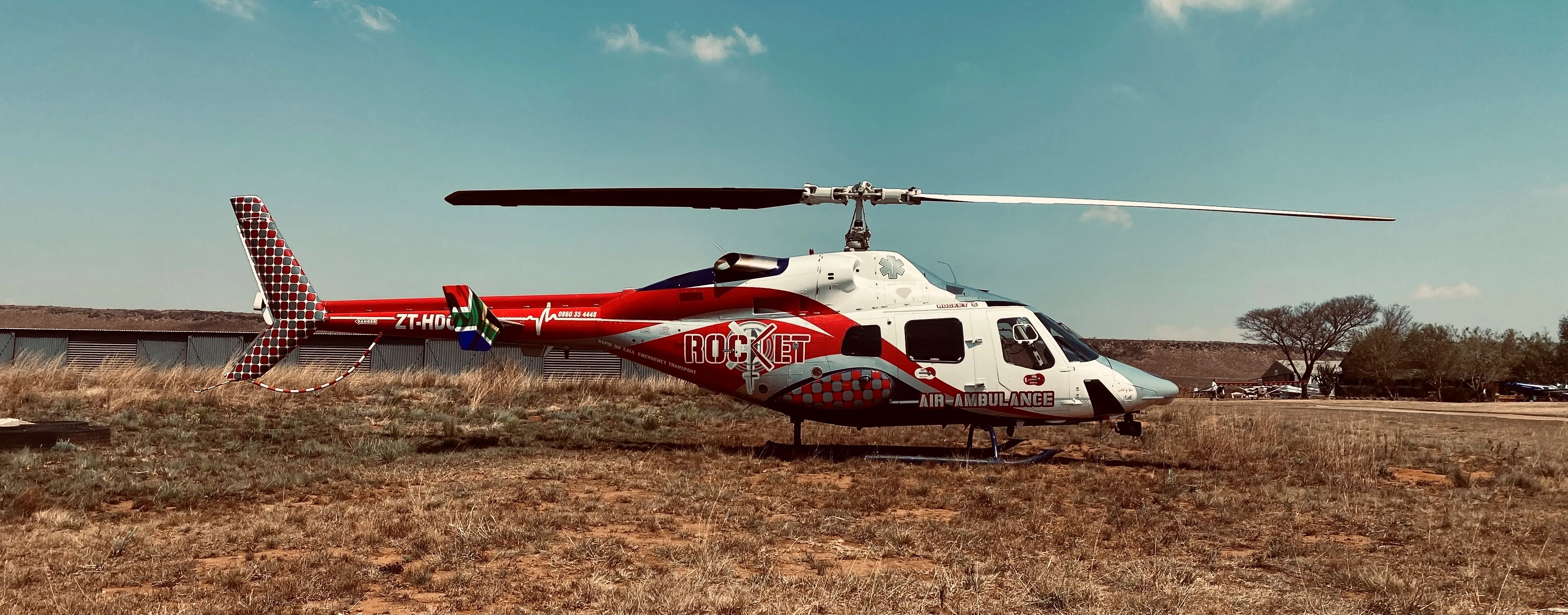 ROCKET CONNECT helicopter positioned in the Northern Cape landscape